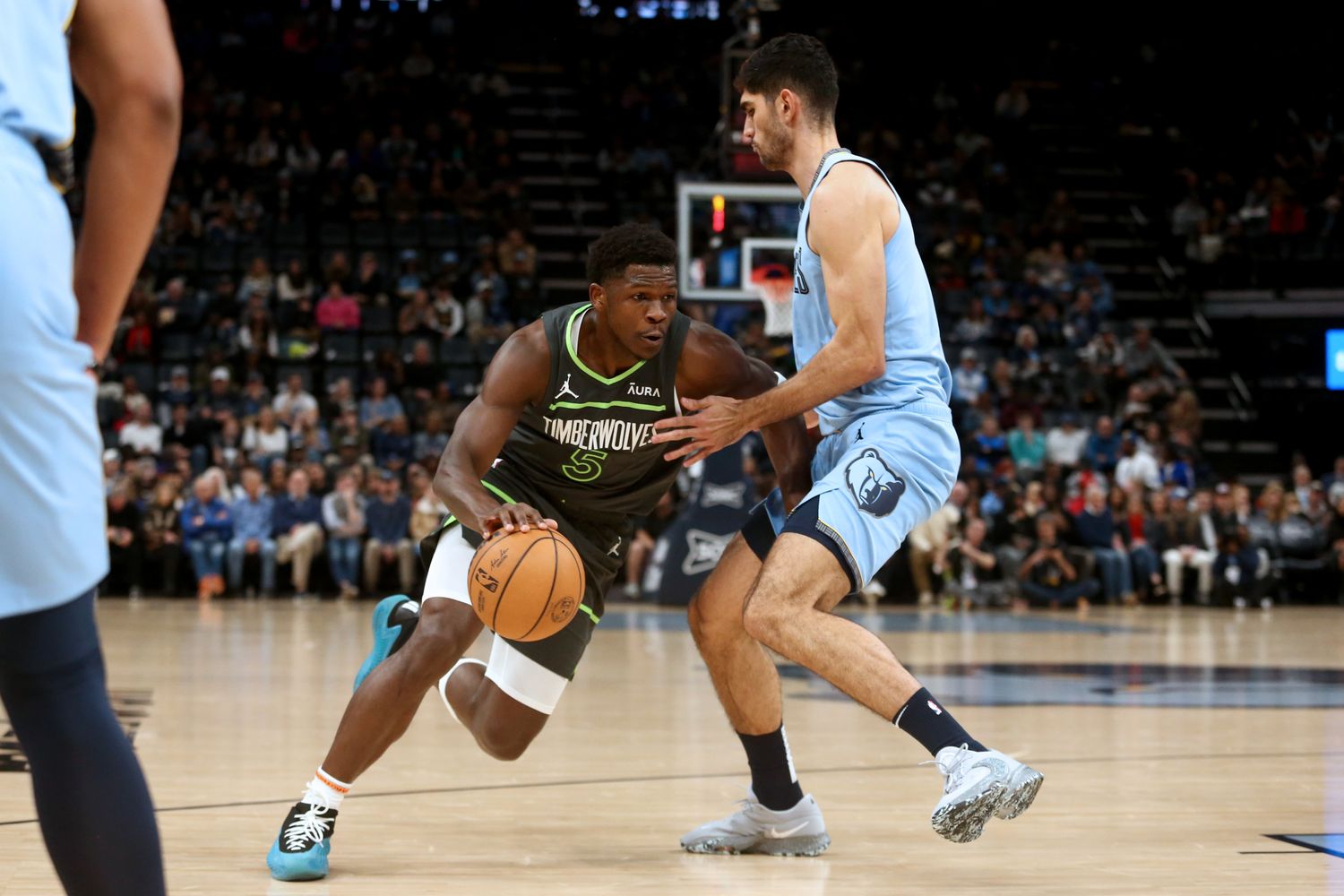 Nov 26, 2023; Memphis, Tennessee, USA; Minnesota Timberwolves guard Anthony Edwards (5) dribbles as Memphis Grizzlies forward Santi Aldama (7) defends during the first half at FedExForum.
